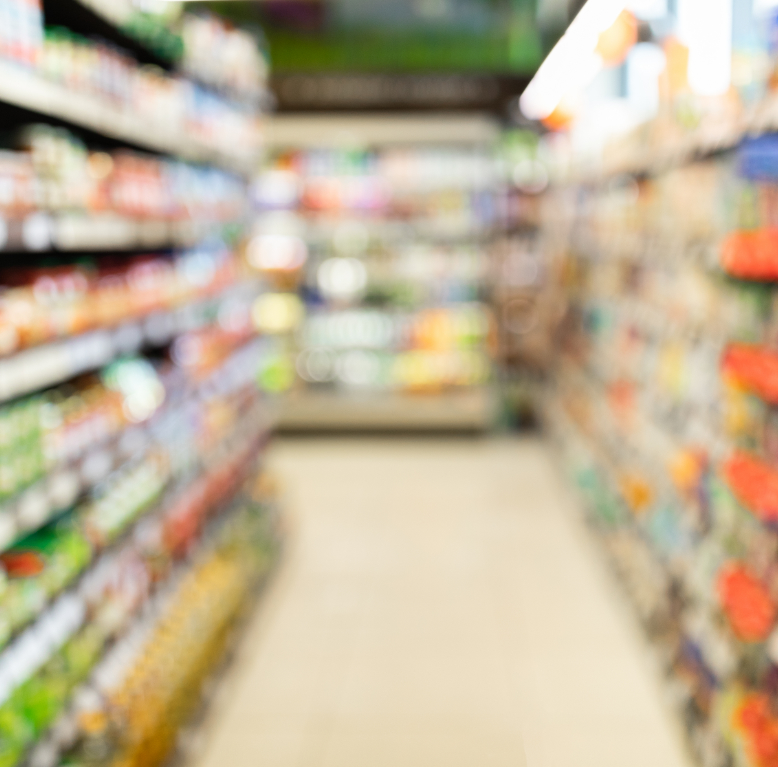 Blurred view of grocery store aisle showcasing products